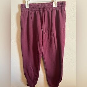 Women’s Adidas drawstring fleece joggers, size S. Deep berry color